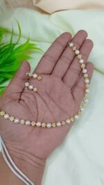 Elegant Floral Stone Studded Pearl Necklace with Matching Earrings.