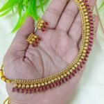 appears to be a traditional South Indian style gold-plated temple jewelry se
