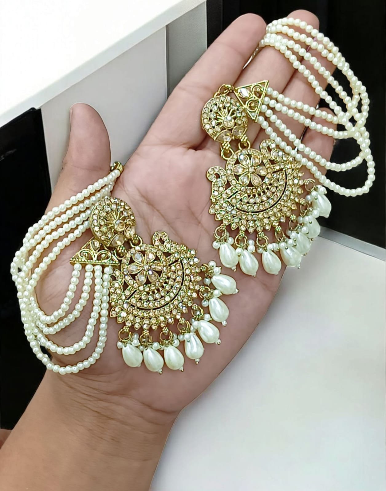 WhatsApp-Image-2026-02-14-at-23.40.38.jpeg golden tana earrings featuring a multi-layered pearl chain design. - Image 1