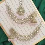 Pakistani-style mirror worked jhumka earrings and a tikli