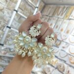 earrings are traditional Indian Kundan and pearl chandbali earrings