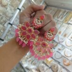 earrings are traditional Indian Kundan and pearl chandbali earrings