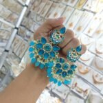 earrings are traditional Indian Kundan and pearl chandbali earrings