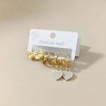 stainless steel 6-piece earring set featuring heart-shaped drops and studs.