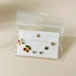 stainless steel 6-piece earring set featuring heart-shaped drops and studs.