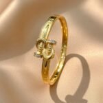 gold-tone bracelet is a pave hook clasp bracelet