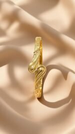 a gold-plated bangle bracelet