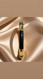 gold and black enamel bracelet,