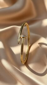 item pictured is a Cartier Juste Un Clou bracelet,