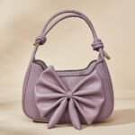 lavender faux leather mini bow shoulder bag, also available as a crossbody bag with a detachable strap.