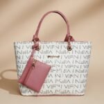 white and pink patterned tote bag with an attached small pouch.