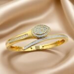 similar items found, this is a gold-plated, open cuff bangle bracelet