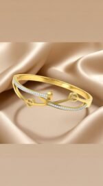 gold-plated, white cubic zirconia studded bangle-style bracelet