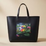 ed Baker London Seacon crosshatch faux-leather tote bag in black with a floral print.