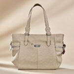 Rosetti Courte Satchel in a soft beige color.