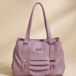 purple ladies' handbag. The specific brand and model are not known based on the available information, leading to low confidence in a precise identification.