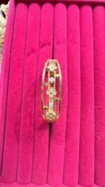 floral-designed bangle featuring clover motifs and crystal accents - Image 2