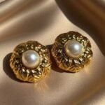 vintage Chanel earrings feature a round,