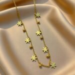 appears to be a dainty floral charm necklace
