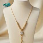 gold-colored pendant necklace