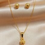 gold-plated chain necklace and matching stud earrings,
