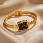 gold-colored watch bracelet