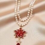 necklace features a trendy double-strand pearl chain