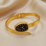 gold-colored watch bracelet