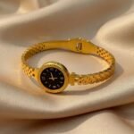 gold-colored watch bracelet